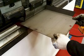Press-bending of metal plates